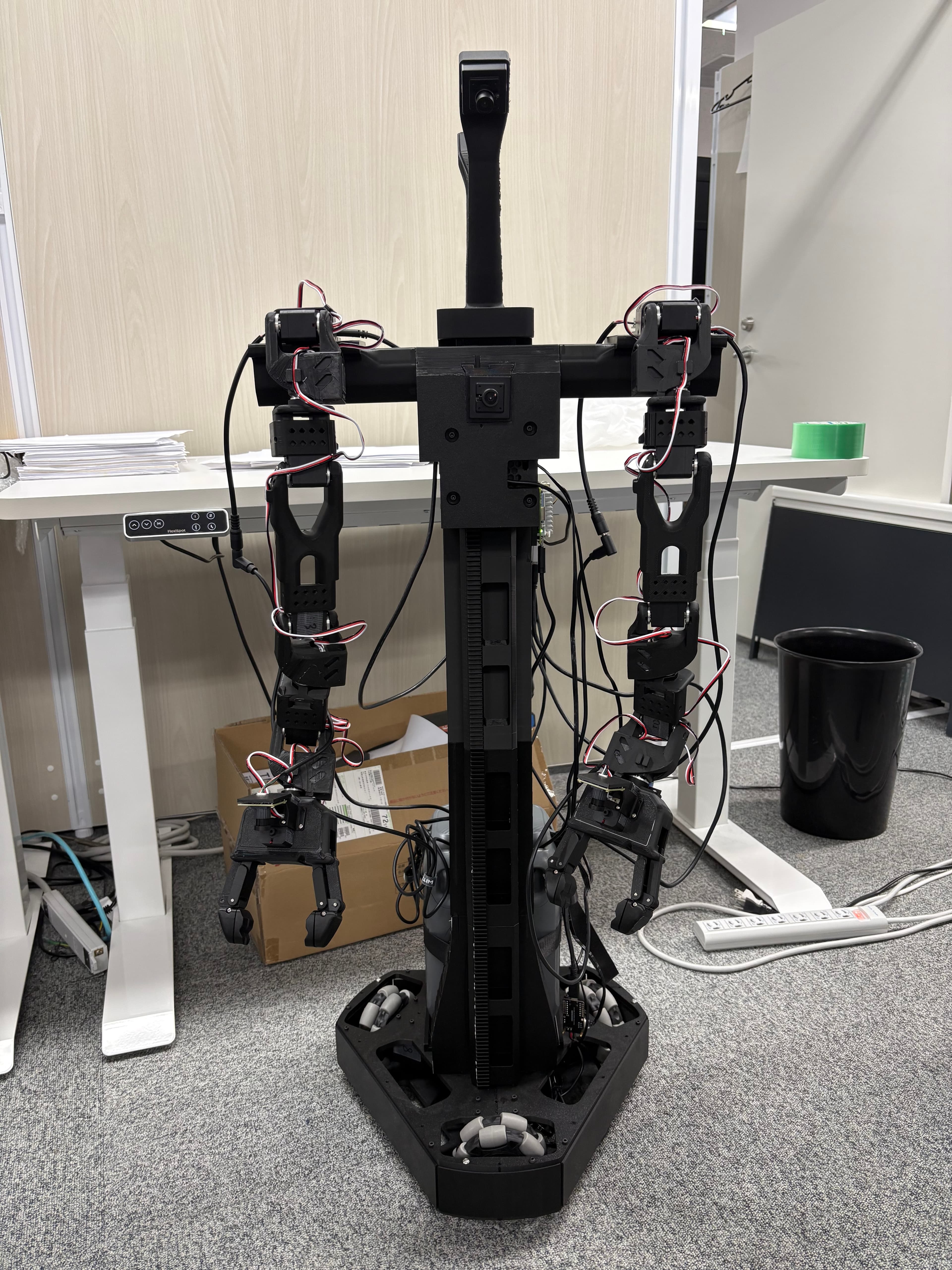A dual-arm robot on a mobile base with a central lift.